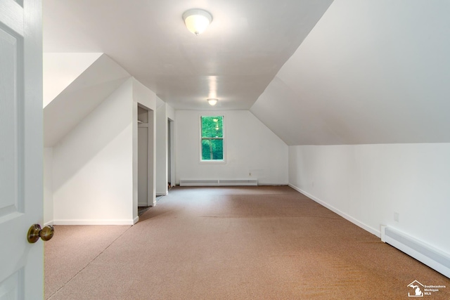 45510 Arkona Rd, Belleville, MI 48111 - additional living space with a baseboard radiator, carpet, baseboards, and vaulted ceiling