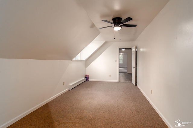 45510 Arkona Rd, Belleville, MI 48111 - additional living space with a baseboard radiator, a ceiling fan, carpet, and baseboards