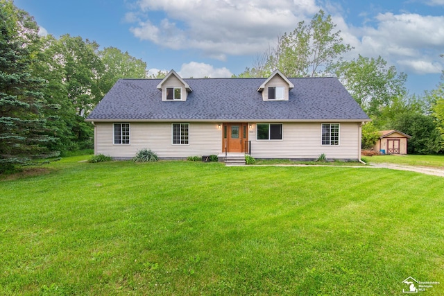 45510 Arkona Rd, Belleville, MI 48111 - cape cod home with a front lawn and a shingled roof