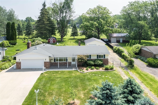 3460 N Gale Rd, Davison, MI 48423 - ranch-style house featuring brick siding, concrete driveway, a garage, and a porch
