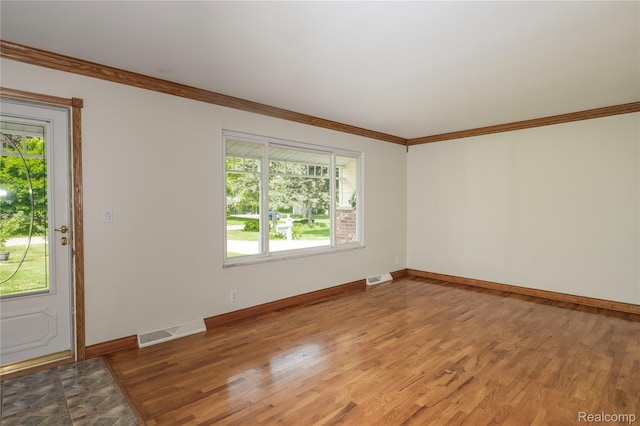 3460 N Gale Rd, Davison, MI 48423 - unfurnished room featuring wood finished floors, ornamental molding, and baseboards