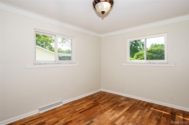3460 N Gale Rd, Davison, MI 48423 - spare room featuring ornamental molding, baseboards, and wood finished floors