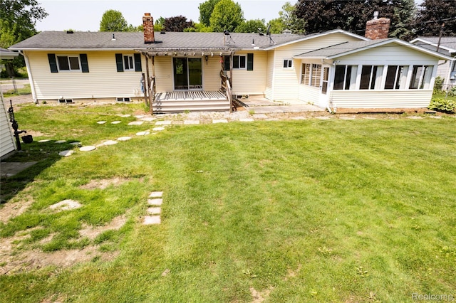3460 N Gale Rd, Davison, MI 48423 - back of property featuring a chimney, a lawn, a sunroom, and a deck