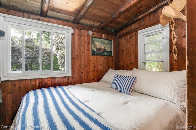 9233 Evee Rd, Clarkston, MI 48348 - bedroom with multiple windows, wood walls, and wood ceiling with exposed beams