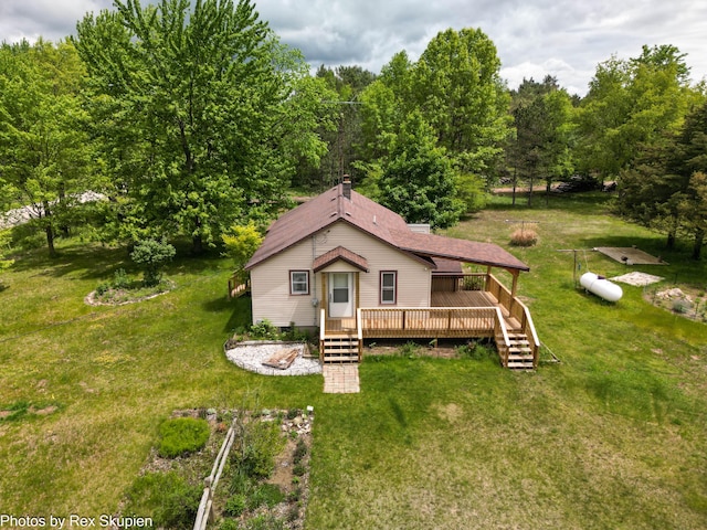 3118 W 104th St, Grant, MI 49327 - view of front of home featuring a deck, a front yard, and stairs