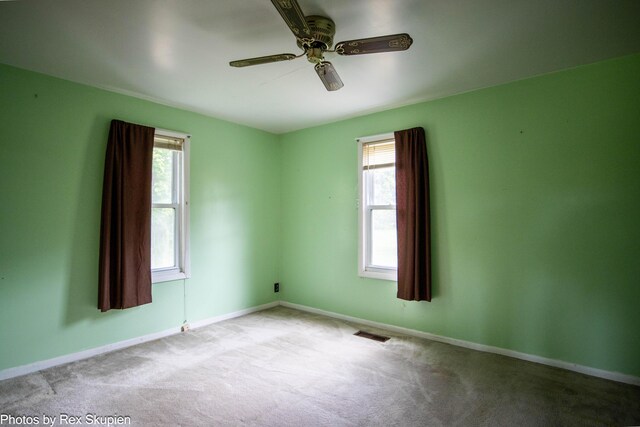 3118 W 104th St, Grant, MI 49327 - unfurnished room featuring healthy amount of natural light, carpet, ceiling fan, and baseboards