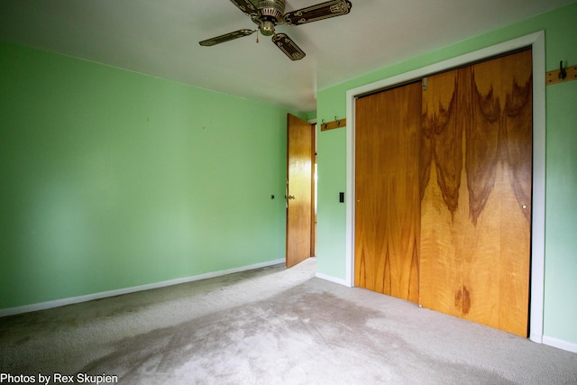 3118 W 104th St, Grant, MI 49327 - unfurnished bedroom featuring carpet floors, a closet, baseboards, and ceiling fan