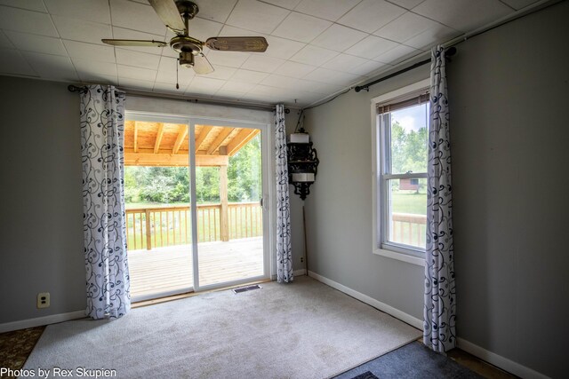 3118 W 104th St, Grant, MI 49327 - spare room featuring plenty of natural light, carpet flooring, ceiling fan, and baseboards