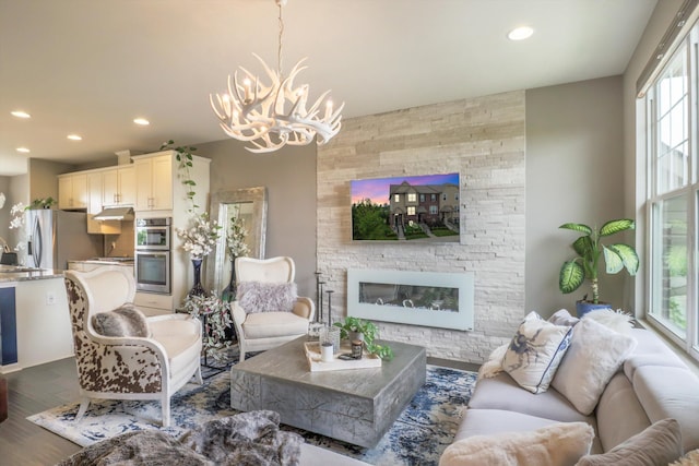 2605 Helmsdale Cir, Rochester, MI 48307 - living area featuring a chandelier, recessed lighting, wood finished floors, and a fireplace