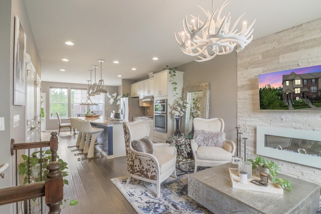 2605 Helmsdale Cir, Rochester, MI 48307 - living area with dark wood finished floors, recessed lighting, a chandelier, and baseboards