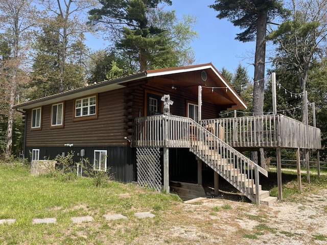 32480 W Old Chip Rd, Paradise, MI 49768 - view of front of property featuring log exterior, stairs, and a deck