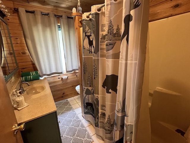 32480 W Old Chip Rd, Paradise, MI 49768 - bathroom featuring vanity, tile patterned flooring, wood ceiling, and wooden walls