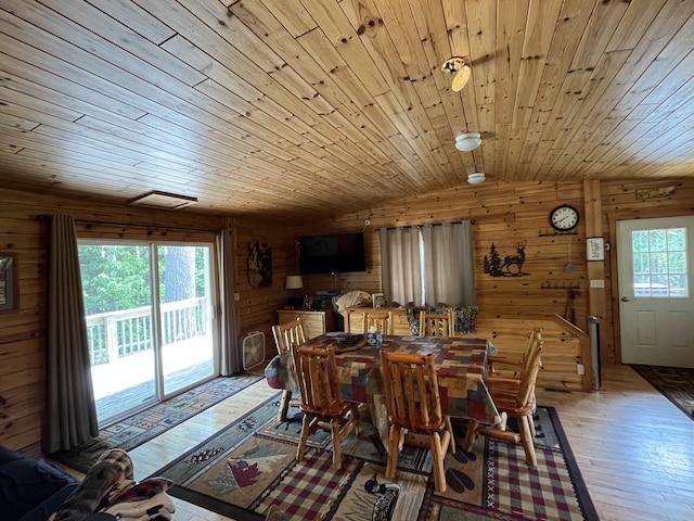 32480 W Old Chip Rd, Paradise, MI 49768 - dining space featuring wood walls, light wood finished floors, vaulted ceiling, and wood ceiling