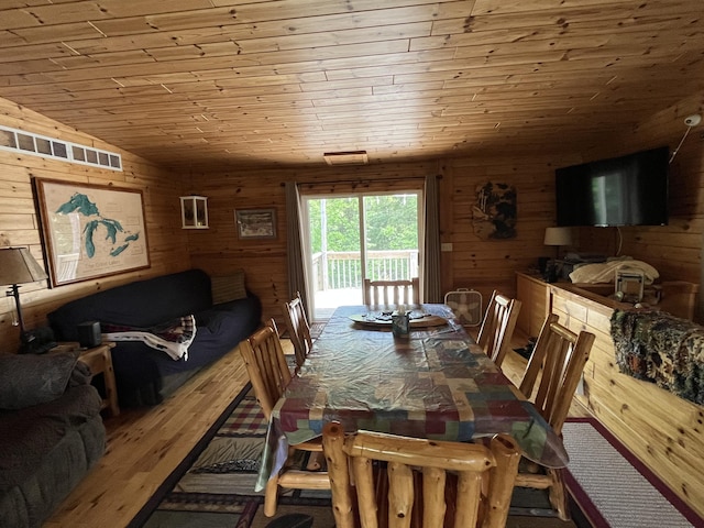 32480 W Old Chip Rd, Paradise, MI 49768 - dining area featuring wooden ceiling, wood walls, and vaulted ceiling