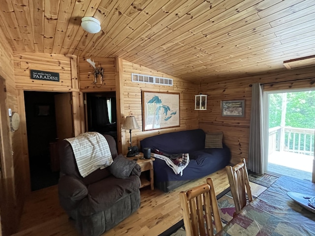 32480 W Old Chip Rd, Paradise, MI 49768 - living area with lofted ceiling, wood ceiling, and wood walls