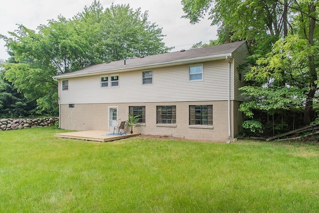 6604 E H Ave, Kalamazoo, MI 49048 - rear view of property with a wooden deck and a lawn