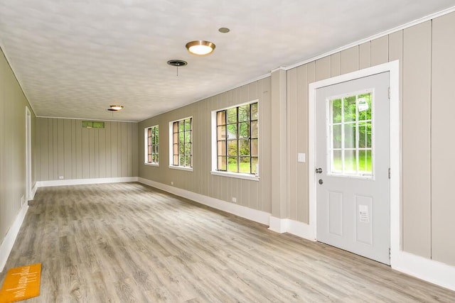 6604 E H Ave, Kalamazoo, MI 49048 - foyer entrance featuring light wood-style floors and baseboards