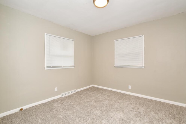6604 E H Ave, Kalamazoo, MI 49048 - unfurnished room with carpet flooring, baseboards, and a baseboard heating unit