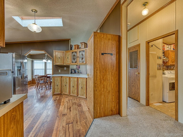 285 Heather, Temperance, MI 48182 - kitchen featuring a skylight, arched walkways, a textured ceiling, crown molding, and stainless steel fridge