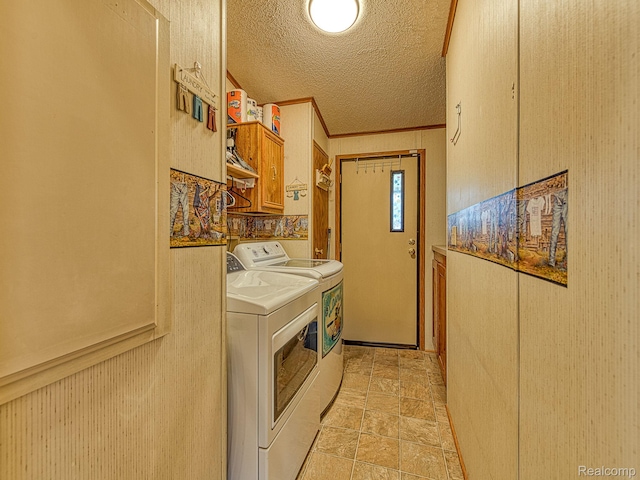 285 Heather, Temperance, MI 48182 - laundry room featuring washing machine and dryer, cabinet space, a textured ceiling, and light stone finish flooring