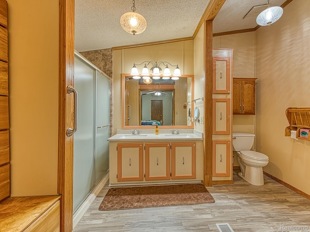 285 Heather, Temperance, MI 48182 - bathroom with toilet, wood finished floors, a stall shower, vanity, and ornamental molding