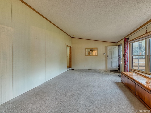285 Heather, Temperance, MI 48182 - carpeted empty room featuring lofted ceiling, crown molding, and a textured ceiling