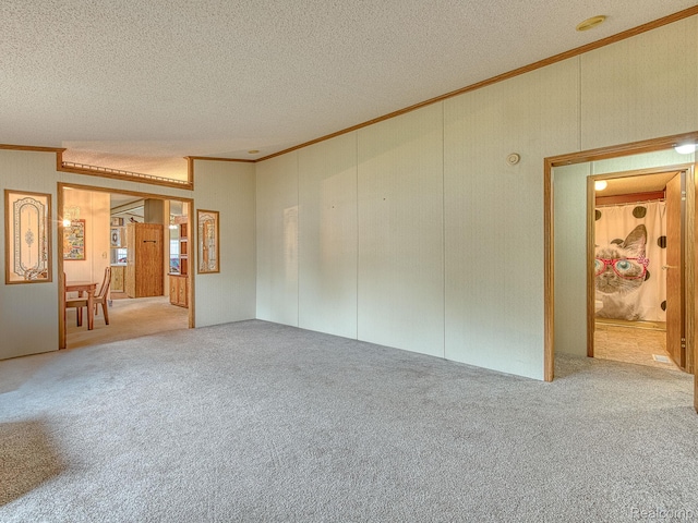 285 Heather, Temperance, MI 48182 - empty room with crown molding, a textured ceiling, and carpet