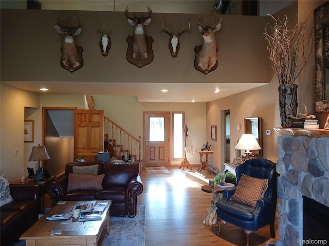 1455 Sand Rd, Port Austin, MI 48467 - living room featuring wood finished floors, stairs, and recessed lighting