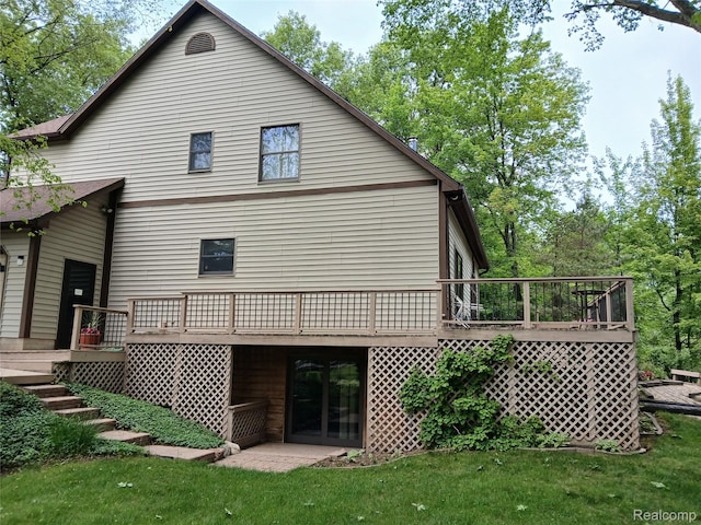 1455 Sand Rd, Port Austin, MI 48467 - back of house with a wooden deck and a yard