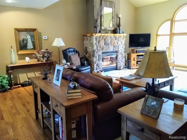 1455 Sand Rd, Port Austin, MI 48467 - living area with wood finished floors and a fireplace
