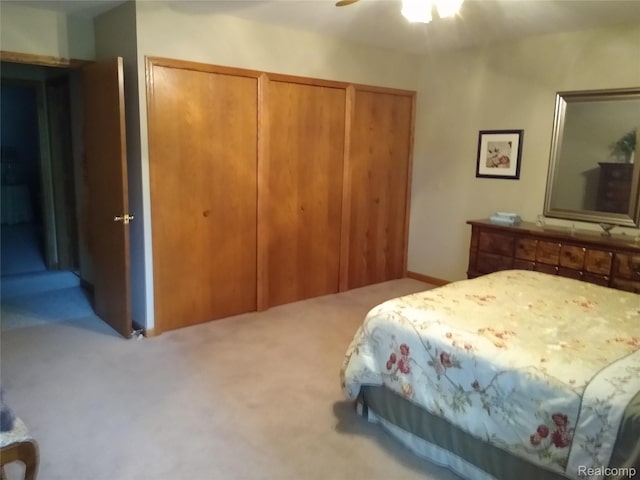 1455 Sand Rd, Port Austin, MI 48467 - carpeted bedroom featuring multiple closets and ceiling fan
