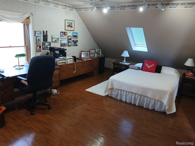 1455 Sand Rd, Port Austin, MI 48467 - bedroom with wood finished floors, lofted ceiling, a desk, and a skylight