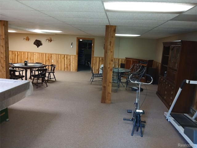 1455 Sand Rd, Port Austin, MI 48467 - workout room featuring a wainscoted wall, carpet flooring, wooden walls, and a paneled ceiling
