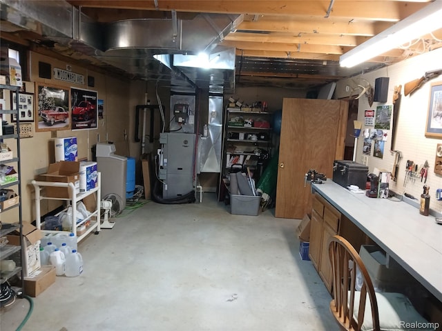 1455 Sand Rd, Port Austin, MI 48467 - unfinished below grade area featuring a workshop area