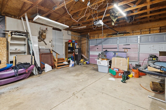 7100 Tripp Rd, Horton, MI 49246 - garage with a garage door opener