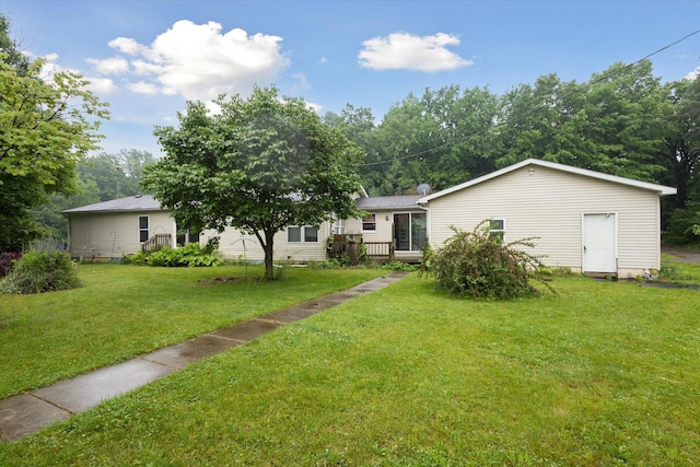 7100 Tripp Rd, Horton, MI 49246 - view of green lawn with a wooden deck