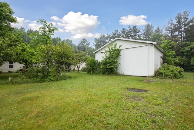 7100 Tripp Rd, Horton, MI 49246 - view of grassy yard featuring an outbuilding and a pole building