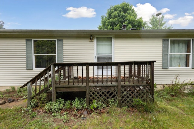 7100 Tripp Rd, Horton, MI 49246 - rear view of house featuring a wooden deck