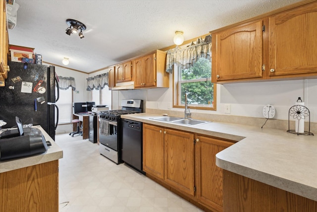 7100 Tripp Rd, Horton, MI 49246 - kitchen featuring black appliances, a sink, under cabinet range hood, healthy amount of natural light, and a textured ceiling
