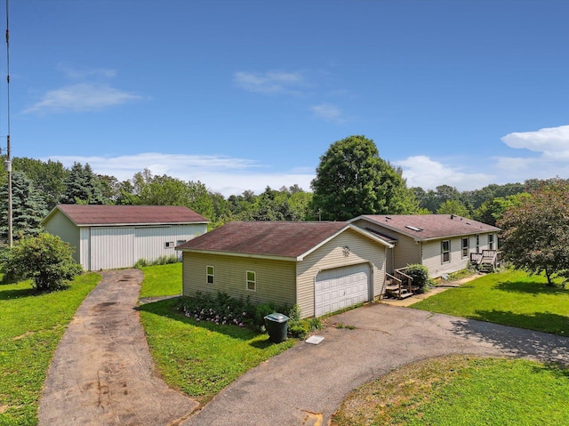 7100 Tripp Rd, Horton, MI 49246 - view of front of property with a front lawn and driveway