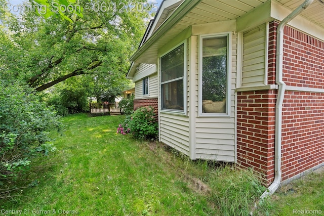 32311 Farmersville Rd, Farmington Hills, MI 48334 - view of property exterior featuring brick siding and a yard