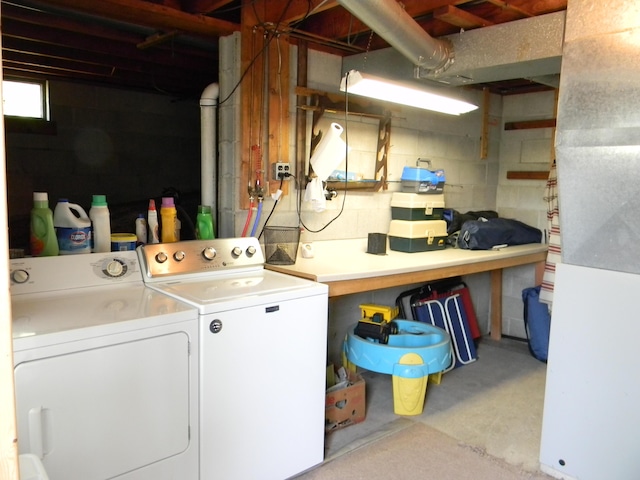 67 S Emerson Dr, Branch, MI 49402 - laundry room featuring washing machine and dryer and concrete block wall