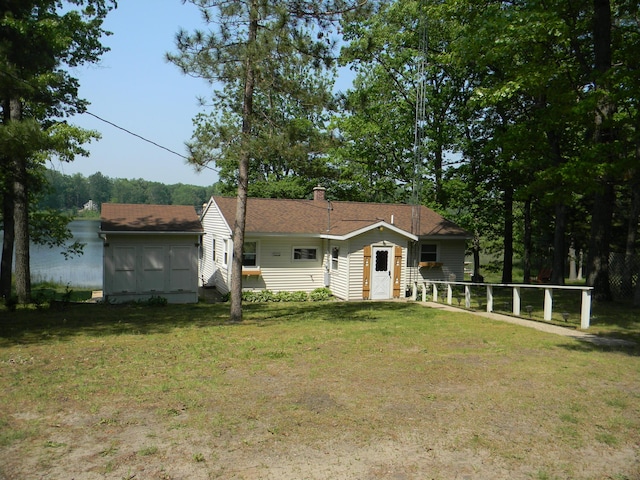 67 S Emerson Dr, Branch, MI 49402 - rear view of property featuring a lawn and a chimney