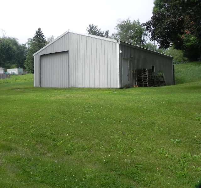 1097 Oliverda Rd, Sherwood, MI 49089 - view of pole building featuring a lawn and central AC unit