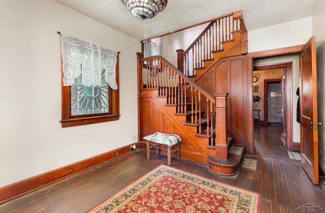 234 N Jackson St, Bay City, MI 48708 - stairs with wood-type flooring and baseboards
