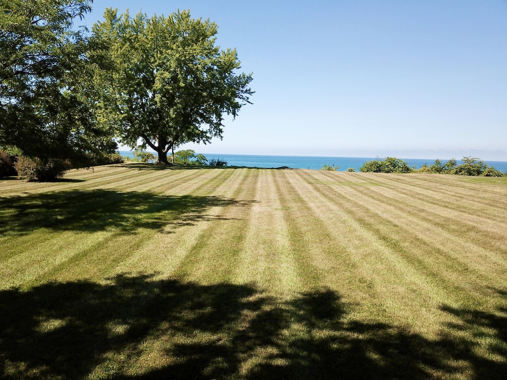 3274 Lakeshore Dr, Saint Joseph, MI 49085 - view of green lawn featuring a water view