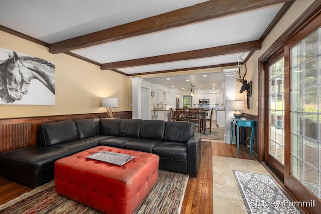 303 Stickney Ridge Rd, Grand Haven, MI 49417 - living room with beam ceiling, light wood finished floors, and ornamental molding
