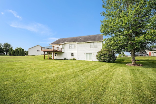 53029 Meadow View Ln, Paw Paw, MI 49079 - rear view of property with a yard and a wooden deck