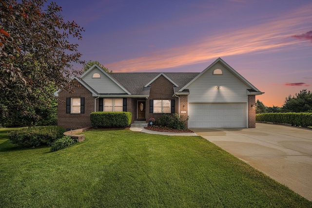 53029 Meadow View Ln, Paw Paw, MI 49079 - traditional home featuring brick siding, driveway, a front lawn, and an attached garage