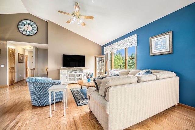 53029 Meadow View Ln, Paw Paw, MI 49079 - living area featuring high vaulted ceiling, a ceiling fan, baseboards, and wood finished floors